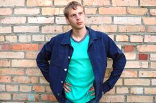 Young Stylish Man Stand Near Brick Wall. Royalty Free Stock Photography Young Stylish Man Stand Near Brick Wall. Royalty Free Stock Photography