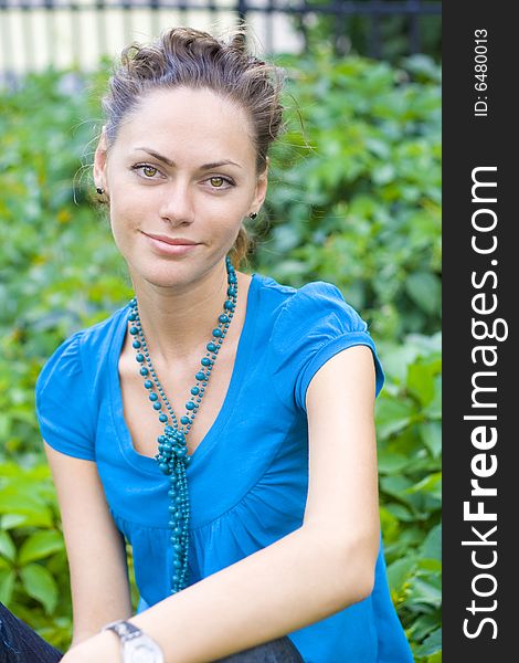 Smiling woman rest in park