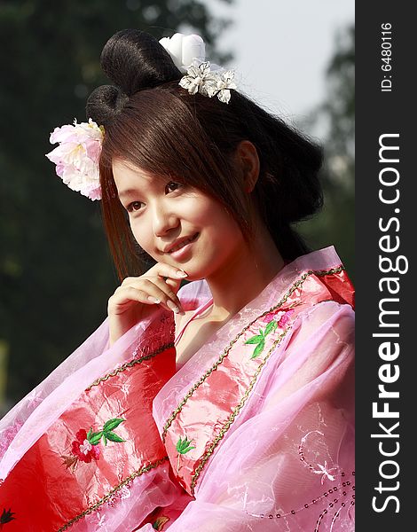 A girl in Chinese ancient dress. She is so beautiful and lovely. A girl in Chinese ancient dress. She is so beautiful and lovely