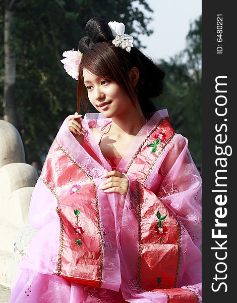 A girl in Chinese ancient dress. She is so beautiful. A girl in Chinese ancient dress. She is so beautiful