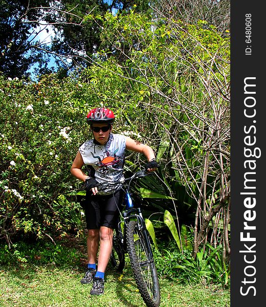 Young cyclist with a mountain bike
