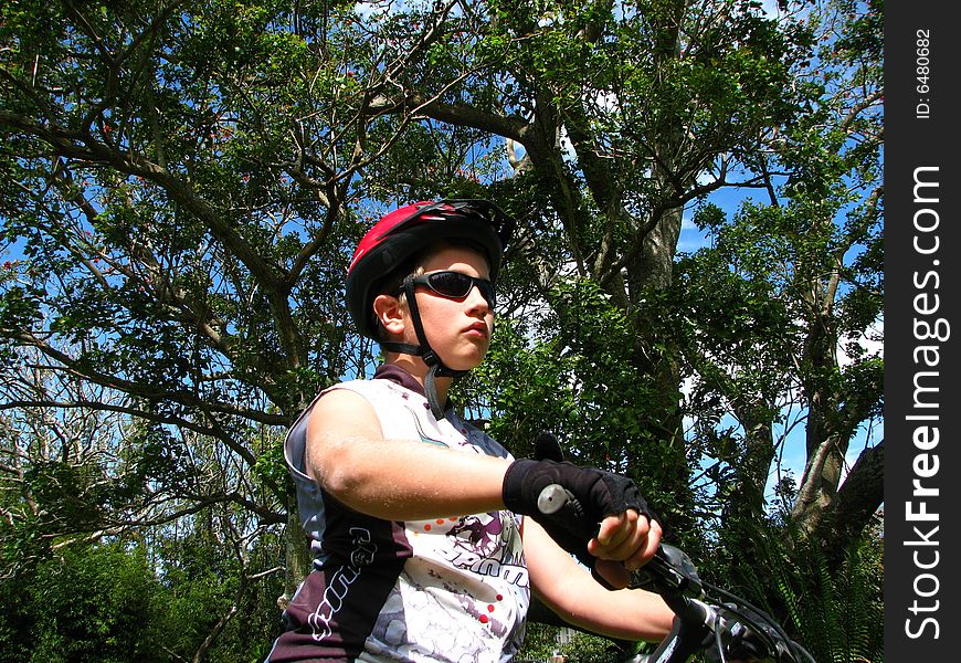 Young cyclist with a bike