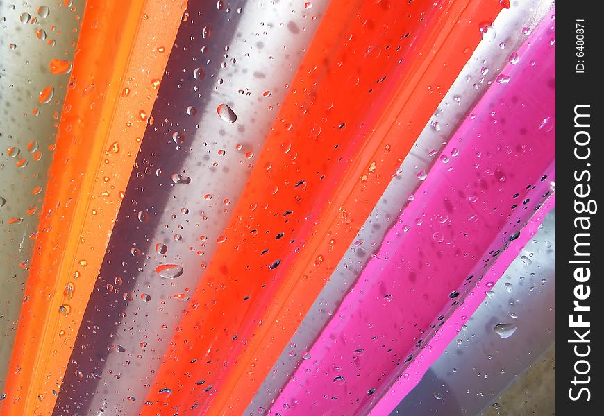 Water Drops over a coloured inflatable mattres