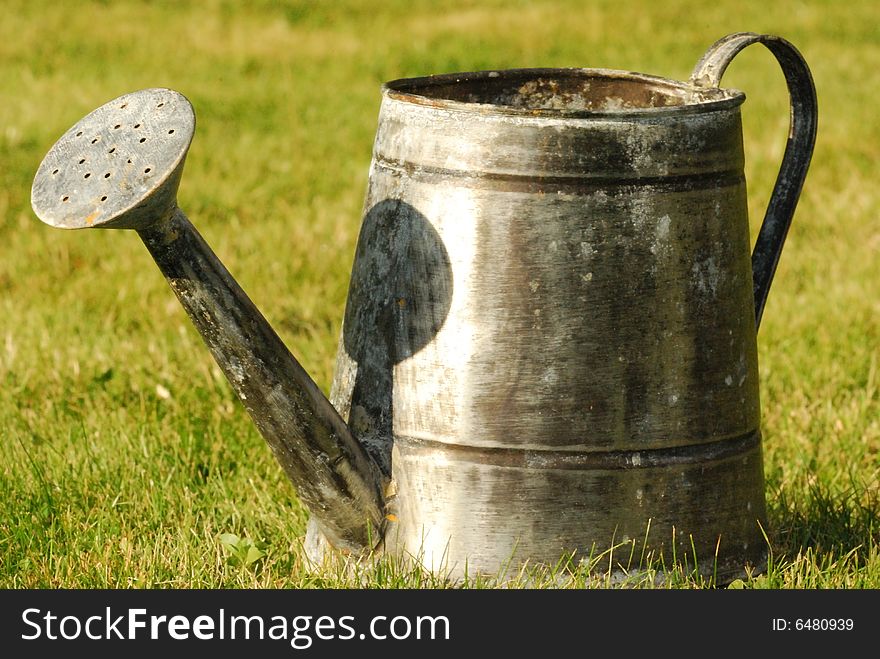 Watering can in a garden