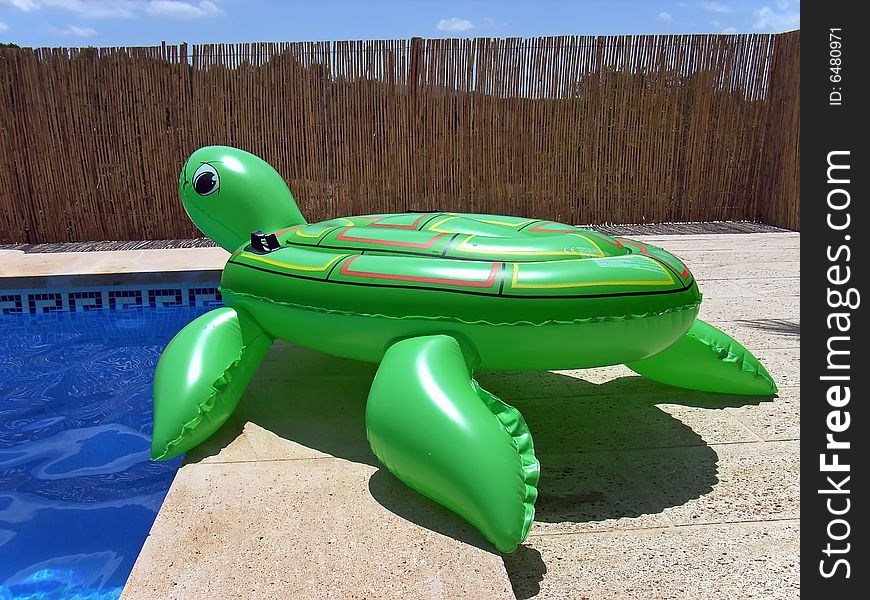 Inflatable turtle near the pool at summer in Spain. Inflatable turtle near the pool at summer in Spain