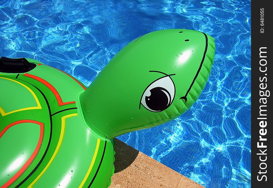 Inflatable turtle near the swimming-pool. Inflatable turtle near the swimming-pool