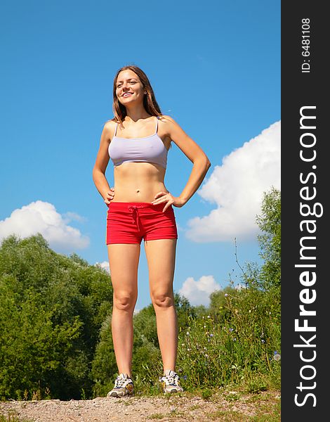 Young woman posing in park, summer