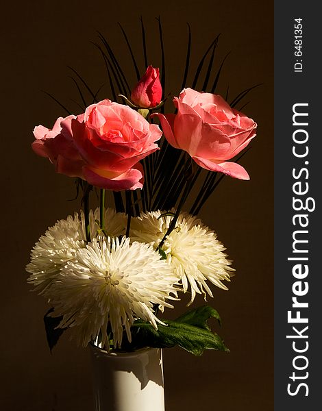 Roses and asters on a dark background. Roses and asters on a dark background