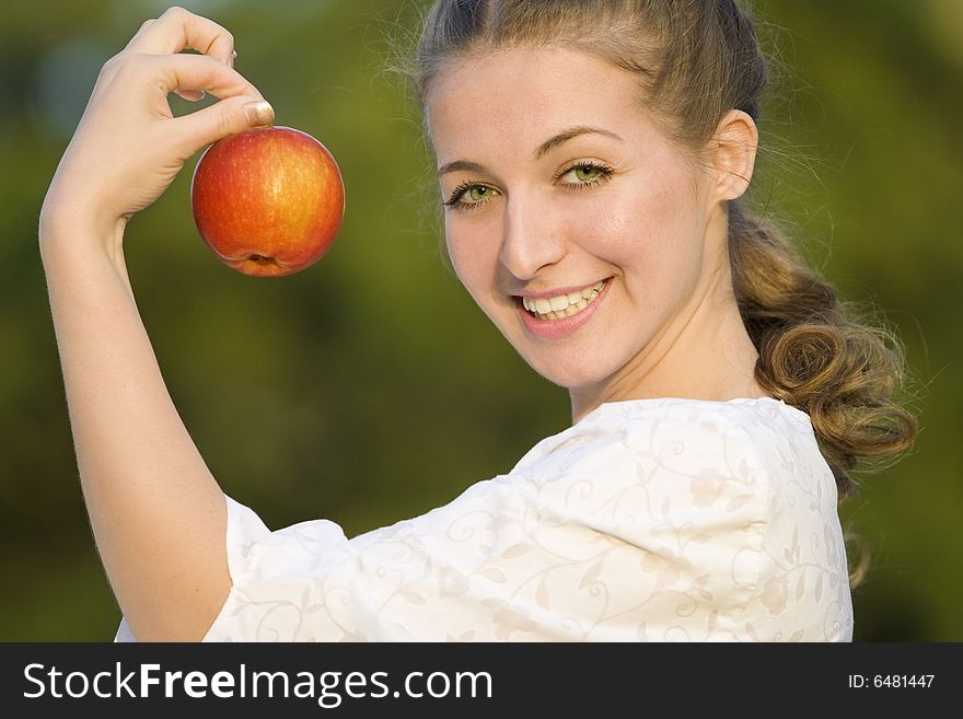 Smiling woman with red apple. Smiling woman with red apple