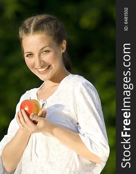 Smiling woman with red apple. Smiling woman with red apple