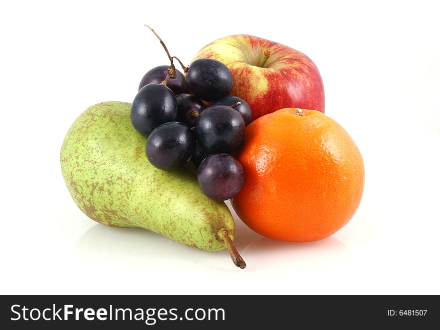 Apple, pear, orange and a bunch of grapes on a white background. Apple, pear, orange and a bunch of grapes on a white background.