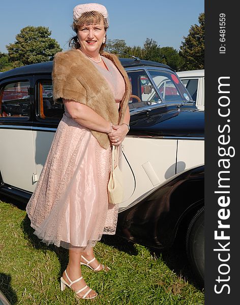 Lady in retro vintage costume at Goodwood Revival event, UK. Lady in retro vintage costume at Goodwood Revival event, UK