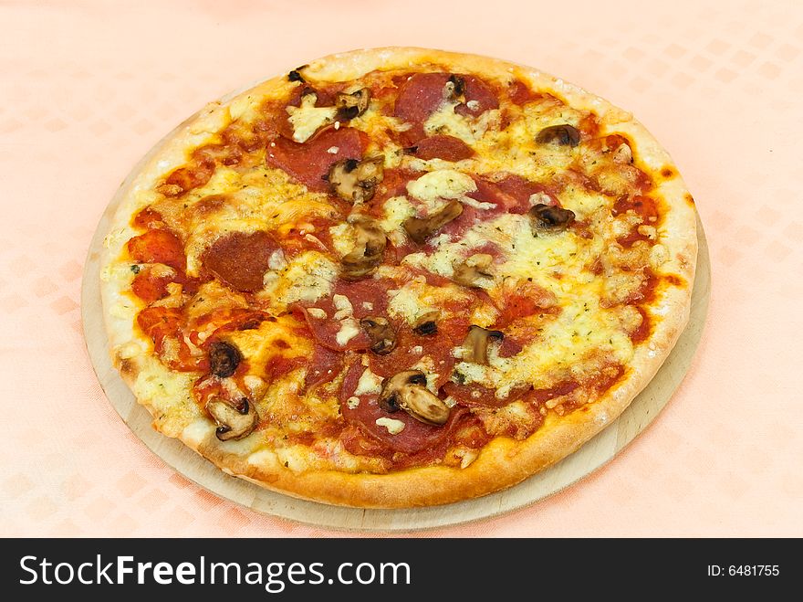 A pizza with cheese,salami - slices.