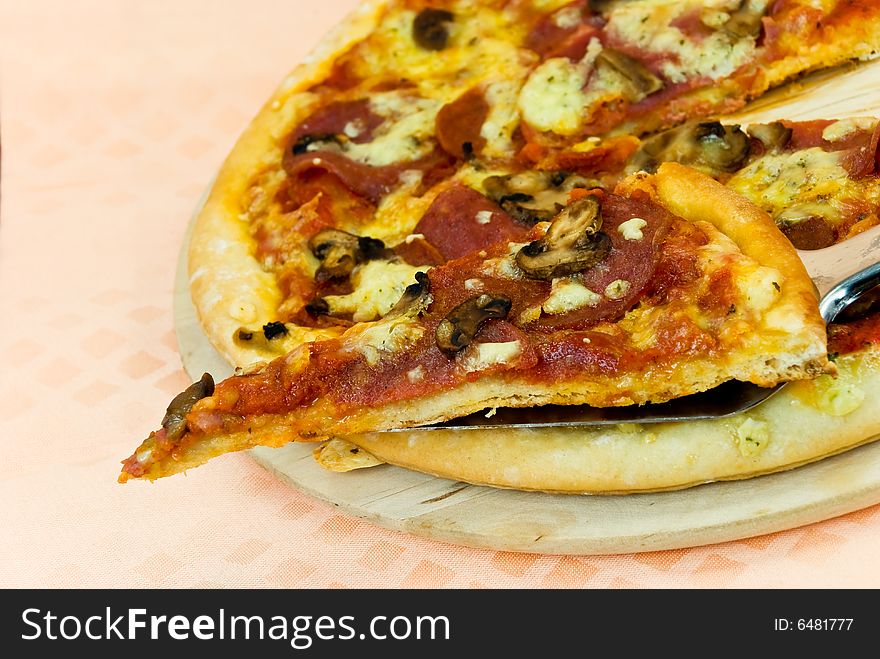 A Pizza With Cheese,salami - Slices