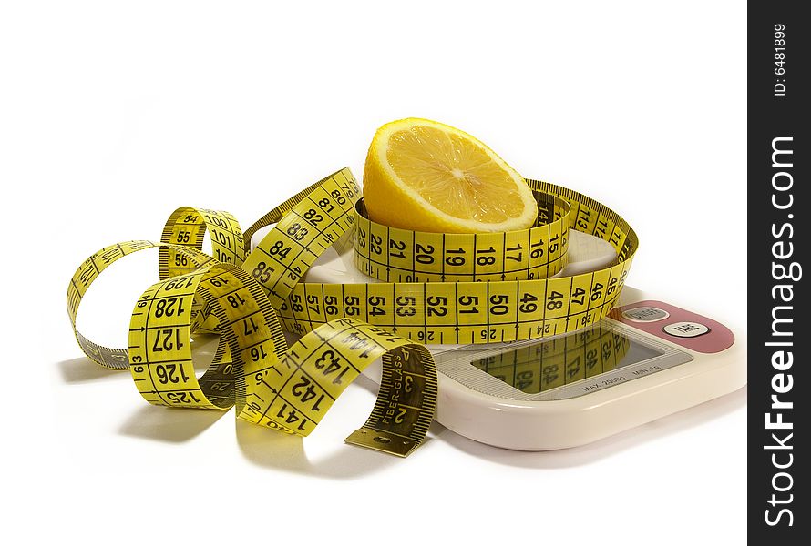 Lemon and tape measure on scale isolated. Lemon and tape measure on scale isolated