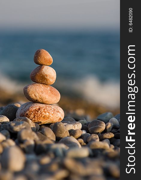 Balanced stones on the sea