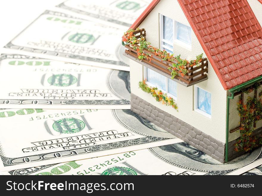 Miniature House and Money. Buying house concept