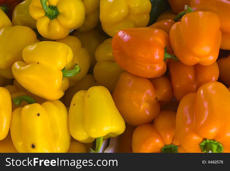 A selection of orange and yellow bell peppers