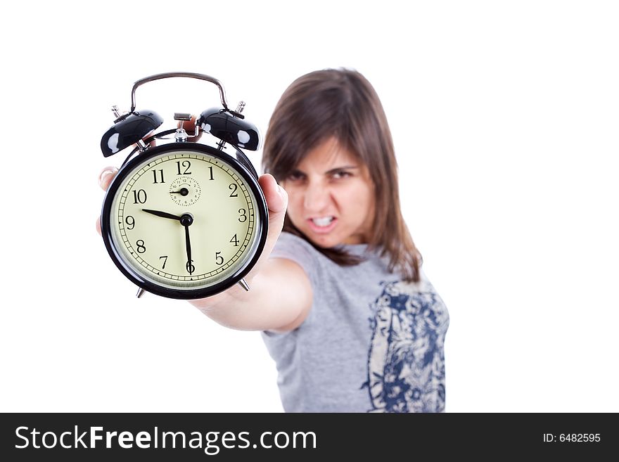 Young woman with alarm clock screaming isolated in white background