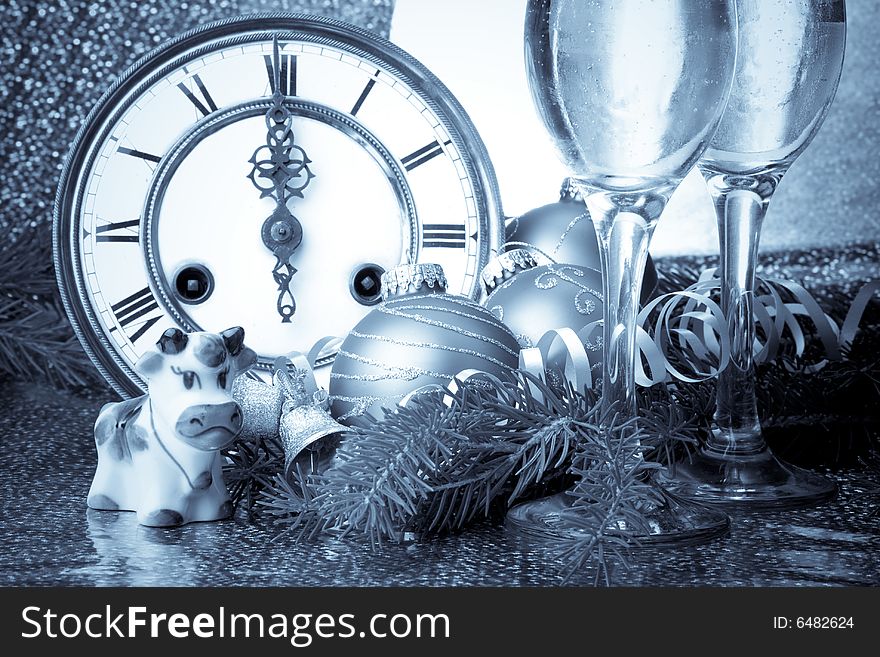New Year's decoration with an antique clock and a firtree branch