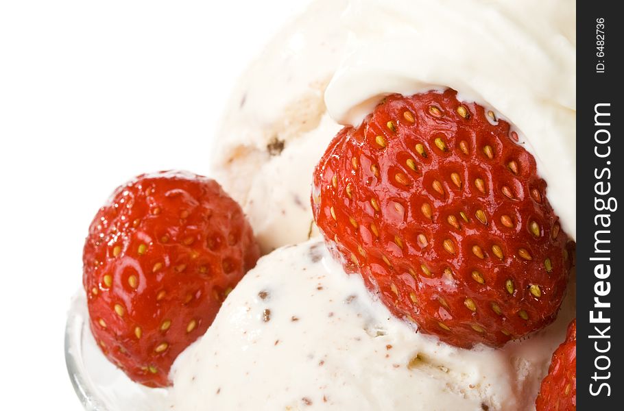 Ice-cream with a strawberries in a glass on a white background.