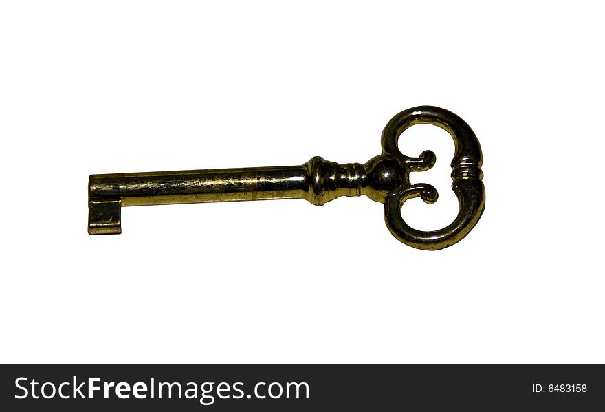 An old antique brass key in an isolated image