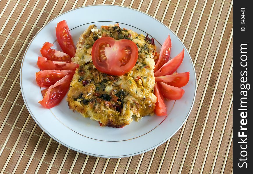 baked pudding with cheese, meat and vegetables