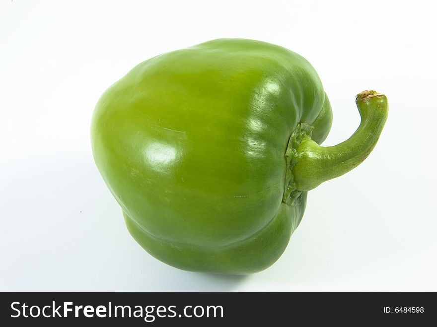 Green bell pepper on white background