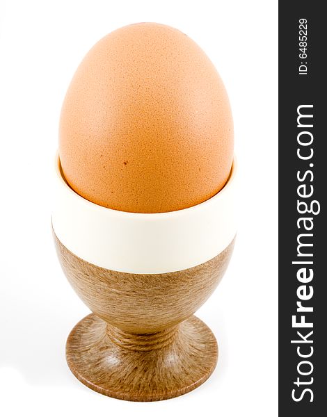 A brown soft boiled egg in the eggcup