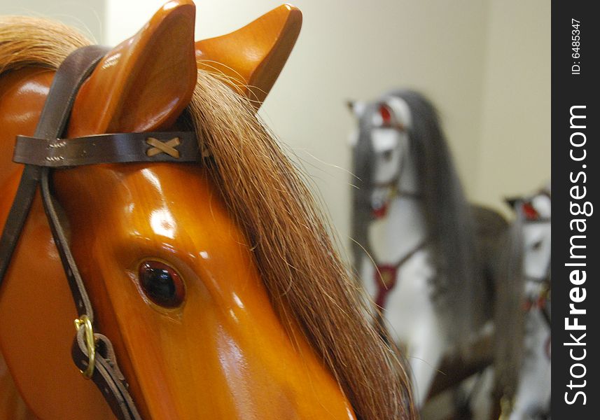 Close-up of varnished wooden rocking horse head