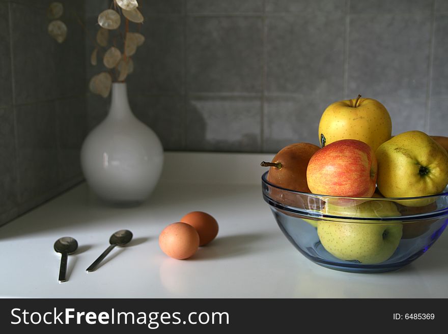 Kitchen composition with eggs and apples. Kitchen composition with eggs and apples