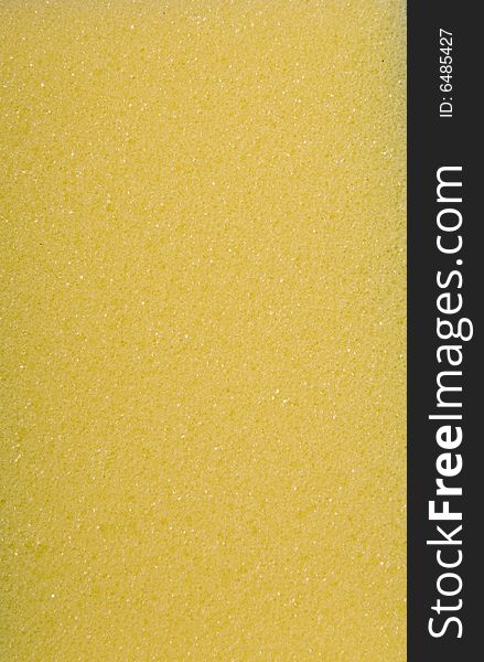 Abstract textured yellow sponge with 1000's pores.