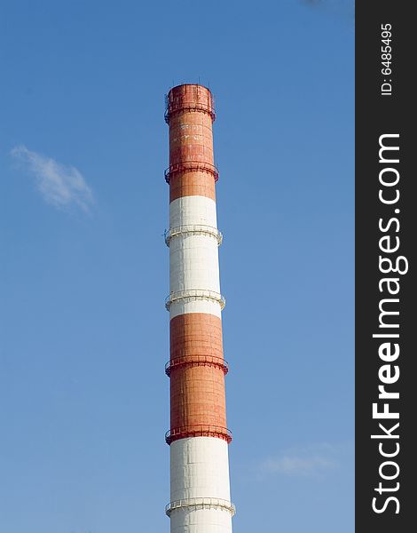 Red and white pipe on blue sky