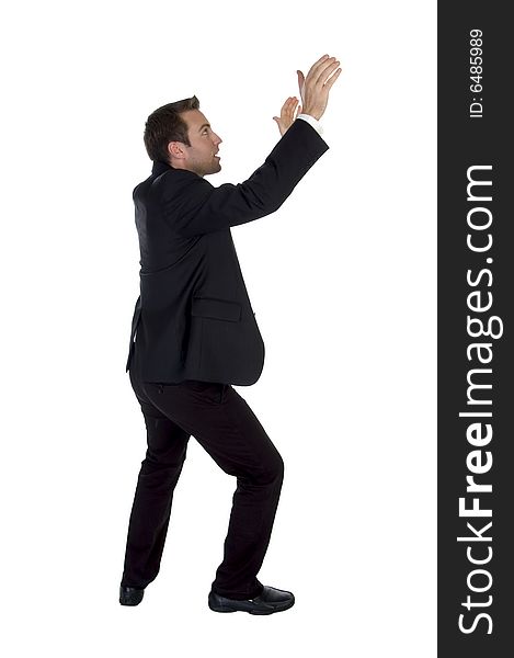 Side view of success businessman with raised hands on white background