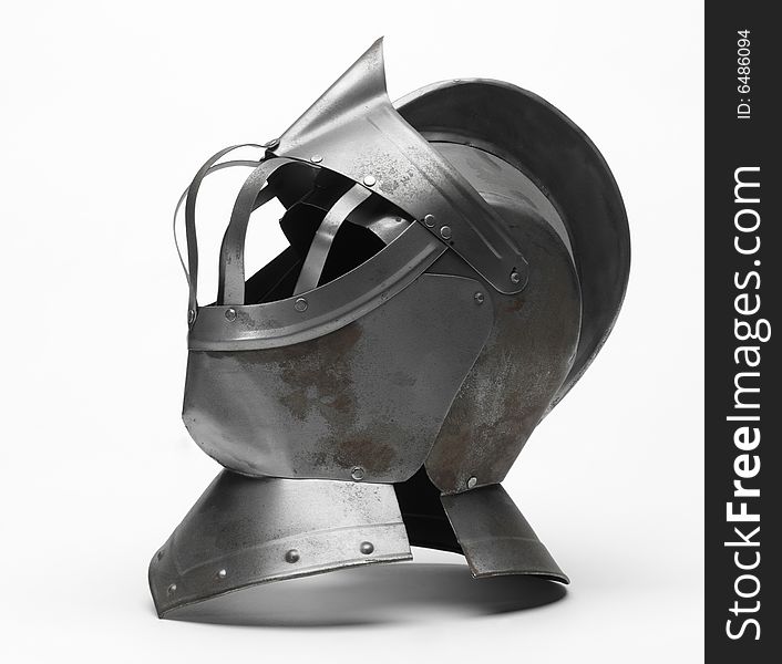 Image of a knight's metal helmet on a white background. Image of a knight's metal helmet on a white background