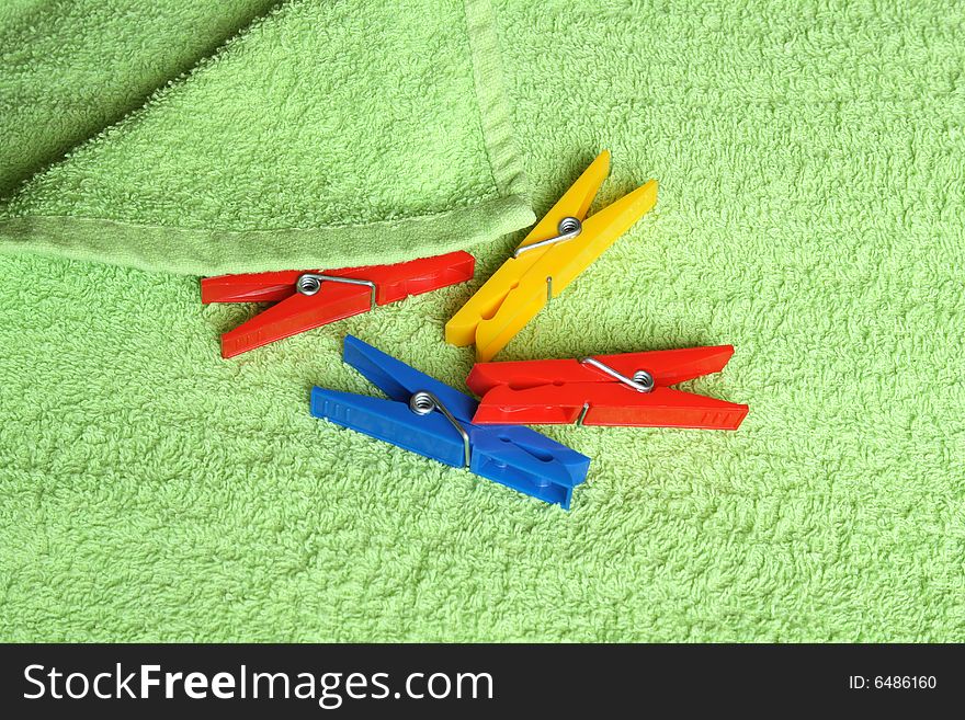 Variegated clothespins on towel