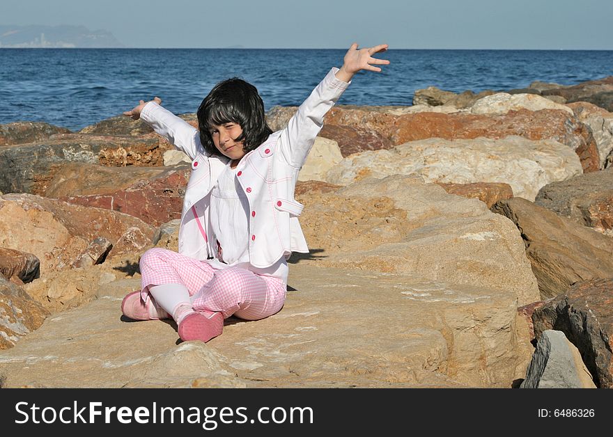 A Little girl making a fun pose. A Little girl making a fun pose