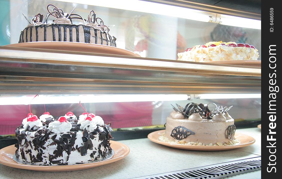 Cakes in the cake display at store