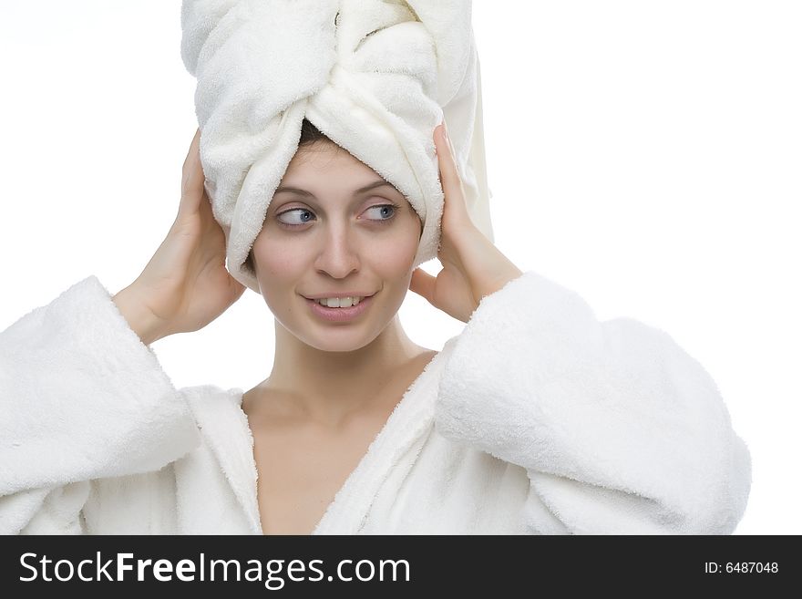 Young and smiling girl wearing a white bathrobe. Young and smiling girl wearing a white bathrobe