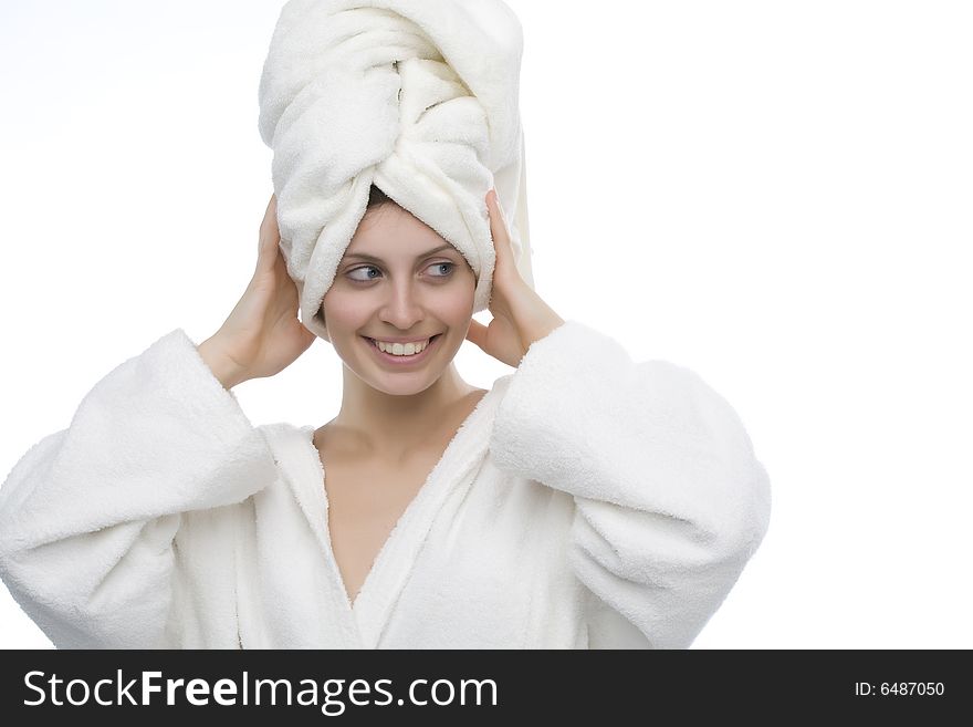 Young and smiling girl wearing a white bathrobe. Young and smiling girl wearing a white bathrobe