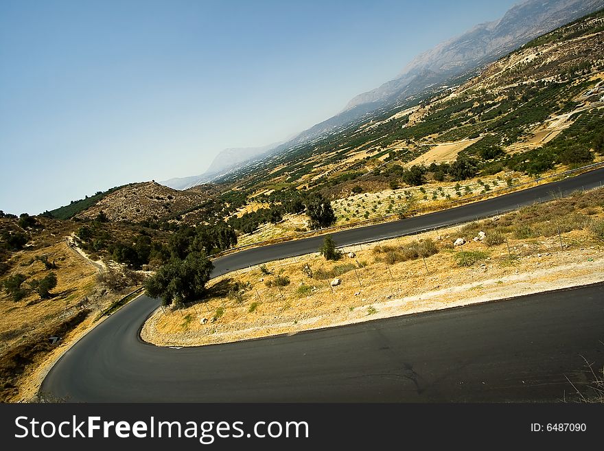 Winding Road With Curves In Mountains