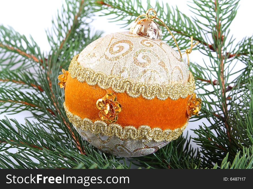 Decorative gold Christmas ball on a christmas tree. Decorative gold Christmas ball on a christmas tree