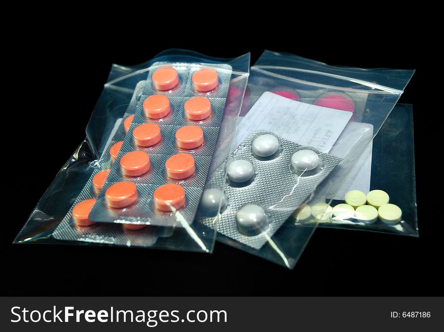 Various Pain killer tablets on black background. Various Pain killer tablets on black background