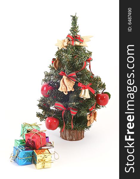 Christmas tree and color gift boxes on white background.