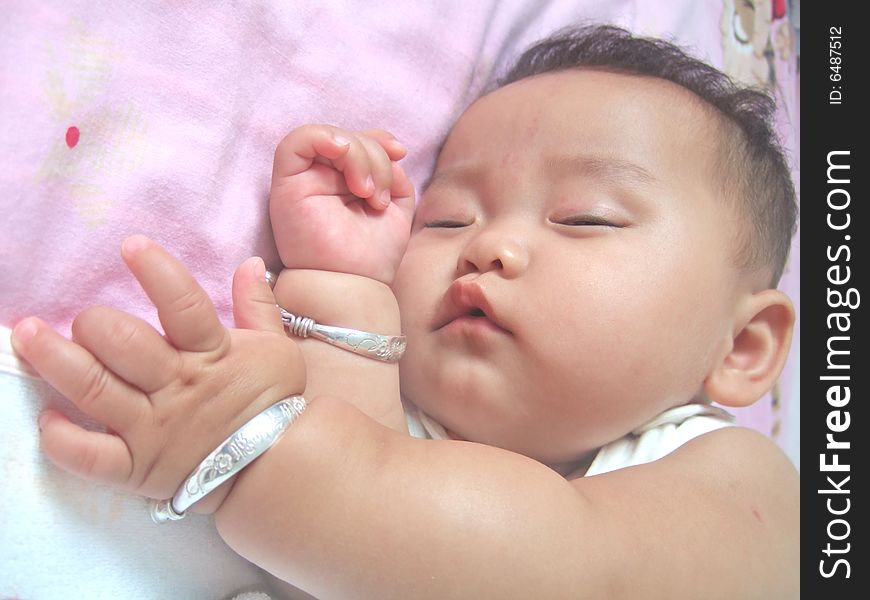 Sleeping Baby on a bed