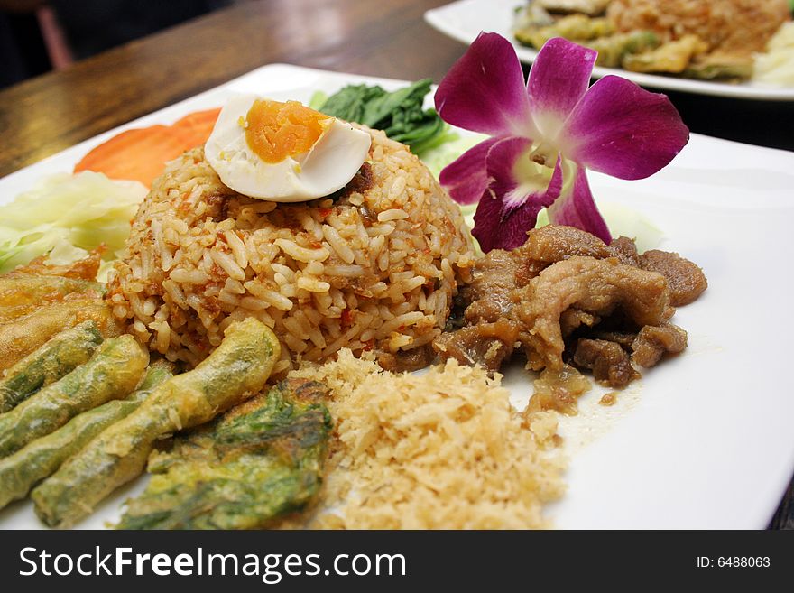 Spicy fried rice with eggs and vegetables. Thai style. Spicy fried rice with eggs and vegetables. Thai style.