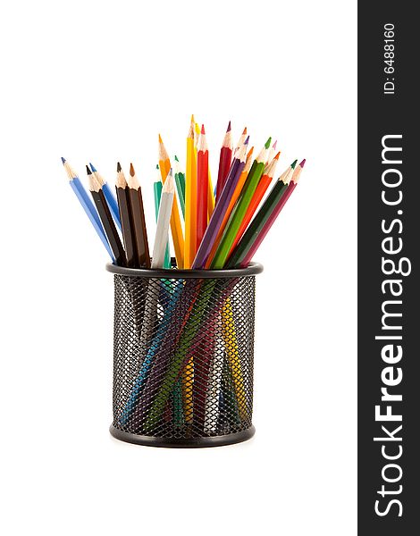 Colored wood pencils on black metal vase