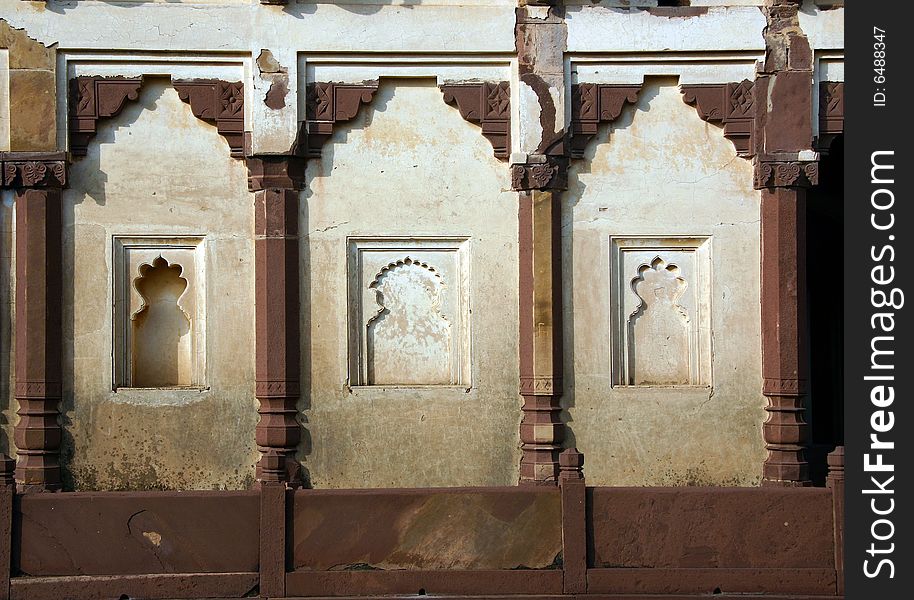 Ornaments shaped windows in a palace in India