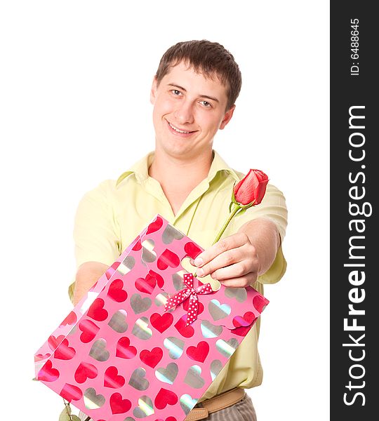 Young man with rose and pink bag, isolated on white background