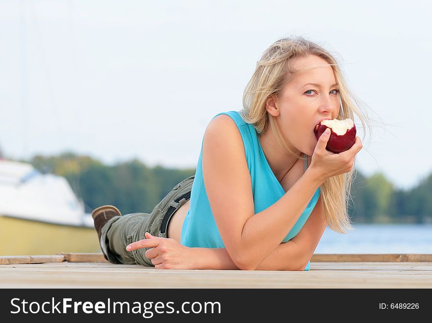 Girl Eating The Apple